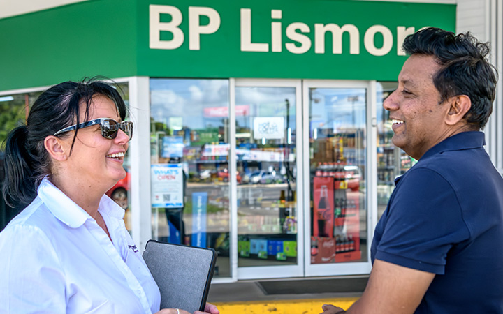 Capricorn Risk Account Manager and Shahzad chatting outside a BP Lismore store.