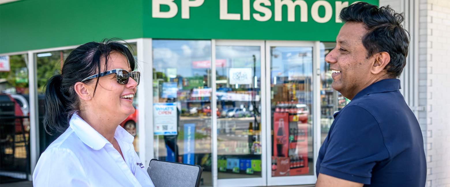 Capricorn Risk Account Manager and Shahzad chatting outside a BP Lismore store.